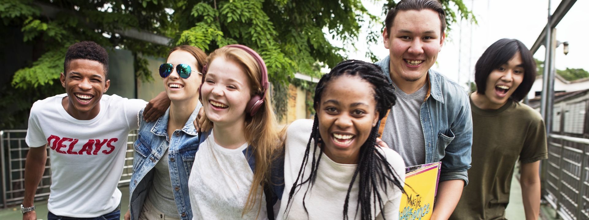 A diverse group of laughing young students.