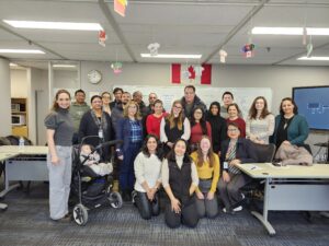 A group of people post in the CBFY office.