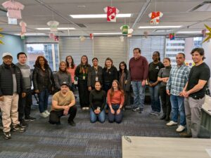 People posing for a group photo in the CBFY office.