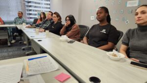 People listen to a presentation about social-emotional learning.